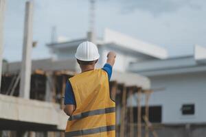worker inspection while in Left hand hold tablet. inspector engineer using tablet. photo