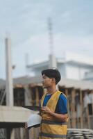 worker inspection while in Left hand hold tablet. inspector engineer using tablet. photo