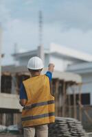 worker inspection while in Left hand hold tablet. inspector engineer using tablet. photo