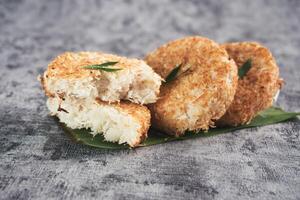Indonesian Traditional Coconut Cake called Sagon on Banana Leaf with Rustic Background Setting photo