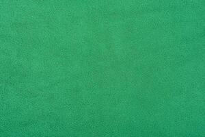 Green suede background macro photo. Green suede leather. photo
