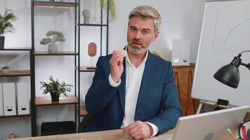 Businessman stock trader earning count bitcoins after online monitoring trading operations at office video