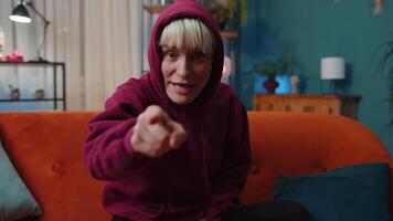 smiling woman pointing to camera, choosing lucky winner, indicating, inviting, approve video