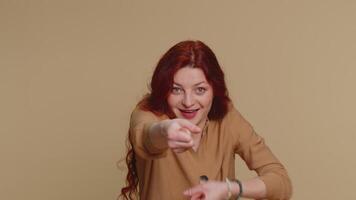 Mime redhead woman pulling an imaginary unreal invisible rope, puts lot of effort, celebrate win video