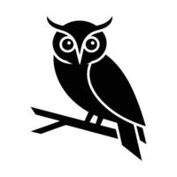 Stylish black silhouette of an owl perched on a branch. vector