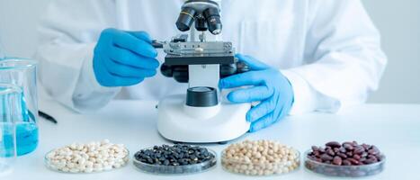 Scientist analyze biochemical samples in advanced scientific laboratory. Medical professional use microscope look microbiological developmental of viral. Biotechnology research in science lab. photo