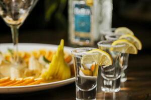 Party guests enjoy drinks and appetizers at a lively gathering photo