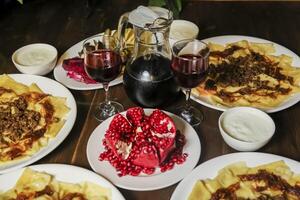 Traditional culinary spread featuring various dishes and drinks photo