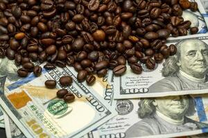 Money and coffee beans create a unique contrast on the table photo