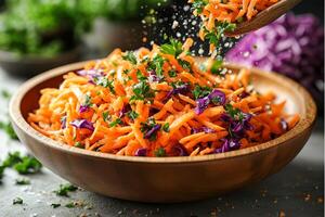 Spring vegetable salad with grated carrots and shredded purple cabbage. photo