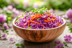Spring vegetable salad with grated carrots and shredded purple cabbage. photo