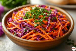Spring vegetable salad with grated carrots and shredded purple cabbage. photo