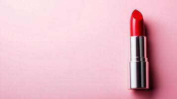 A Striking Red Lipstick on a Soft Pink Background photo
