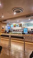 Bekasi, Indonesia on 3 February 2024. Modern Asian Food Court Order Station with Menus photo