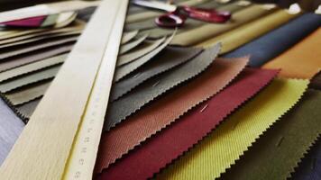 Ruler Scissors and Colorful Fabric Palette Examples in The Tailor Shop video