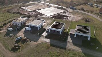 Siauliai, Lithuania, 2024 - aerial top down view workers on rooftop lay surface prepare for solar panels installation for privater home. Green New house real estate side property in city suburbs video