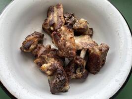 Grilled meat kebabs served on a plate photo