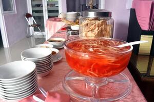 Displayed Es blewah on buffet menu, a refreshing drink that is popular in Indonesia, made from grated cantaloupe, syrup, ice cubes, condensed milk, and other ingredients. photo