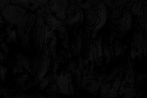 Abstract black background. Black stucco texture. Dark rough surface. Architectural stucco molding made of cement. photo