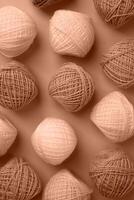 Mocha Mousse - color of the year 2025. yarn wool on brown backdrop, top view flat lay photo