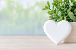 Photo frame of heart shape for mockup design on light table background.