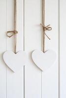 Photo frame of heart shape for mockup design on light wall background.