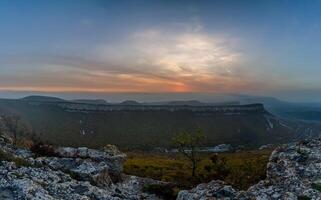Mountains and forests of Crimea. coniferous and deciduous trees on the hills of mountains and rocks photo