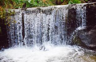 Waterfall on a mountain river in Altai. The rivers are altai. photo
