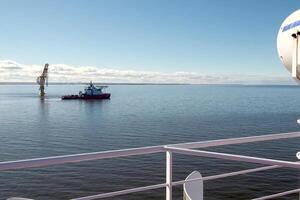 Arctic navigation in summer. Service ships at sea. photo