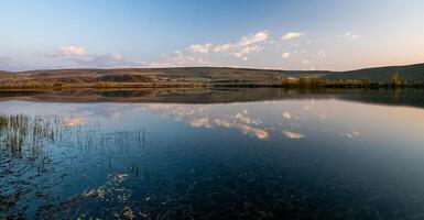 Lake in Altai Mountains. Panorama of the Altai landscape in the mountains. The time of year is autumn. photo