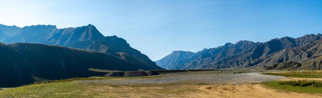 Panorama is Altai, a mountain river flowing between the Altai mountains and the nature of the area. photo