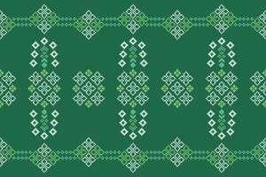 Geometric pixel art of green color ethnic pattern design background motif cross stitch. vector
