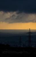 Dawn in the mountains of Crimea. light haze of mist over the mountains and rays of the sun through the clouds. photo