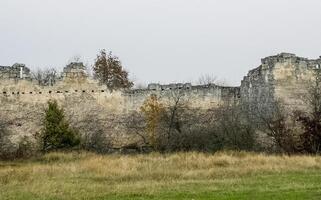 old limestone house on a cliff on the edge of a cliff. photo