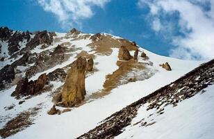 Mount Sayan in winter in snow. The nature of the mountains is sayan. photo