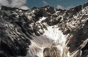 Mount Sayan in winter in snow. The nature of the mountains is sayan. photo