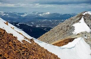 Mount Sayan in winter in snow. The nature of the mountains is sayan. photo