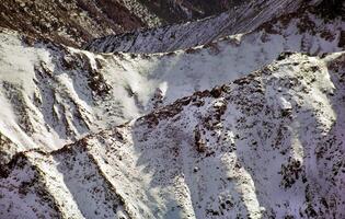 Mount Sayan in winter in snow. The nature of the mountains is sayan. photo