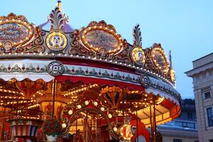 A Charming and Enchanting Carousel at Dusk, Beautifully Enhanced with Illuminated Details photo