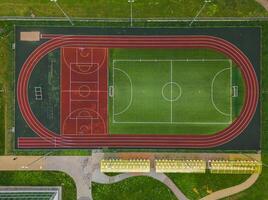 Aerial View of a MultiSport Field Featuring a Track Area and Soccer Pitch for Activities photo