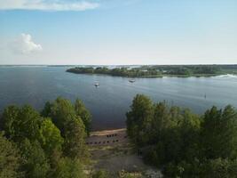 A Serene Lakeside View Featuring Lush Greenery Surrounded by Scenic Natural Beauty photo