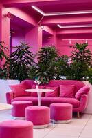Experience the Pink Lounge with Modern Decor and lush Greenery for a delightful ambiance photo