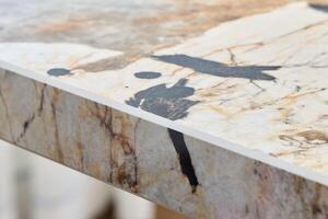 An Exquisite and Elegant Marble Table Detail Showcasing Unique Patterns Alongside Beautiful Textures photo