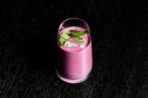 Enjoy a Vibrant Berry Smoothie made with Fresh Herbs for a refreshing boost in your day photo