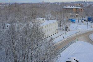 A Beautiful Snowy Winter Landscape Featuring Striking Modern Architecture Elements photo