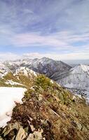Mount Sayan in winter in snow. The nature of the mountains is sayan. photo