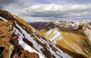 Mount Sayan in winter in snow. The nature of the mountains is sayan. photo