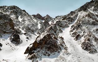 Mount Sayan in winter in snow. The nature of the mountains is sayan. photo