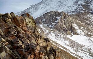 Mount Sayan in winter in snow. The nature of the mountains is sayan. photo