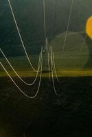 High voltage power line wires, view from another support line tower. photo